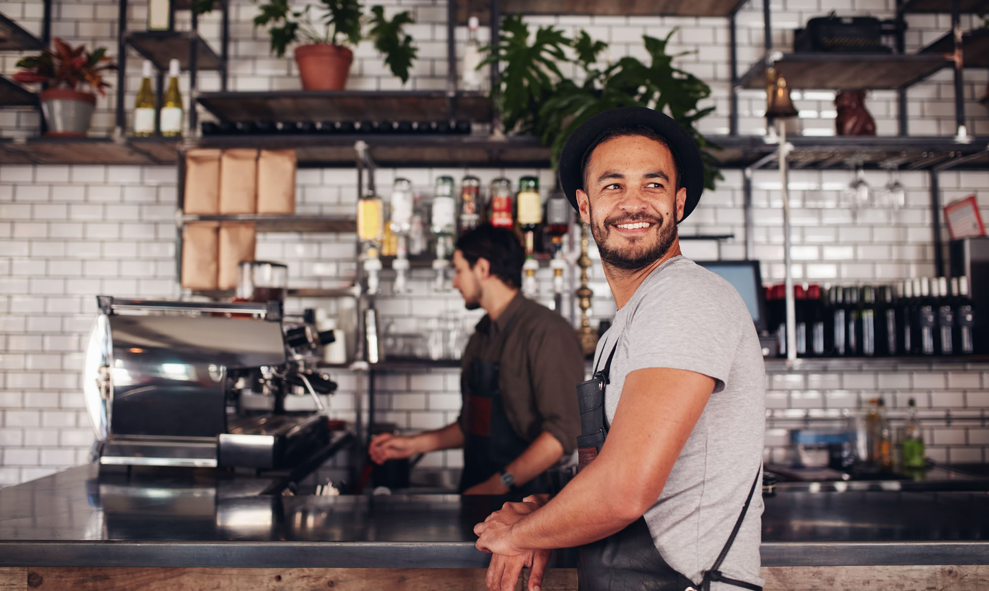 Two baristas in coffee shop