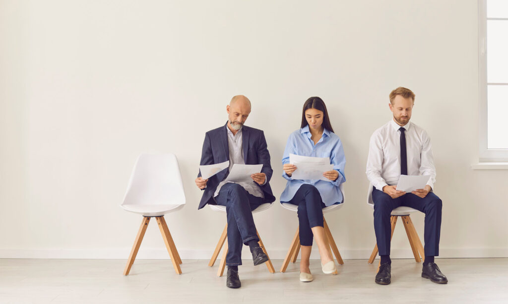 Job candidates sitting down, waiting to be interviewed