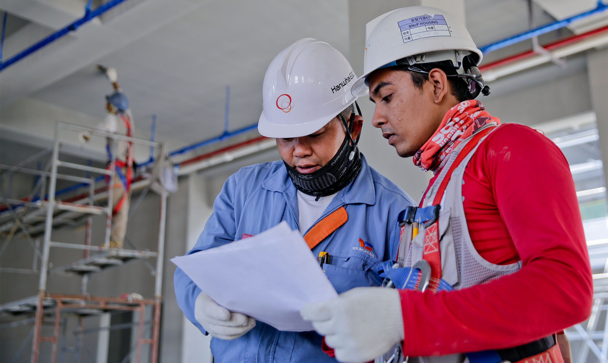 Factory workers in conversation